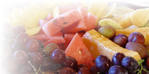A colorful mix of fresh watermelon, grapes, and melon slices.