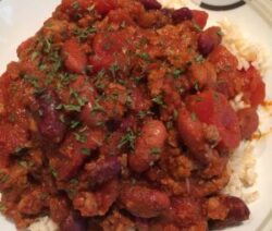Chili con carne with rice and herbs.