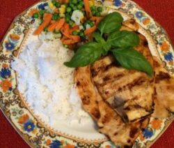 Grilled chicken with rice and vegetables.