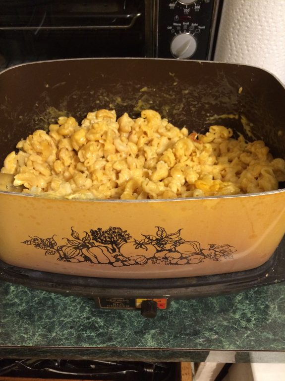 Homemade macaroni and cheese in a vintage casserole dish.
