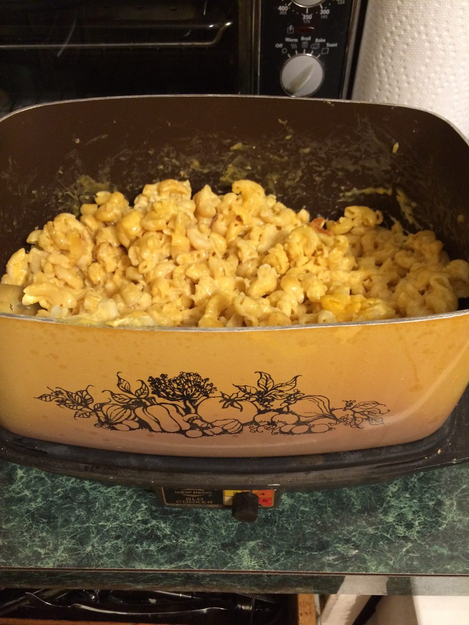 Homemade macaroni and cheese in a vintage casserole dish.