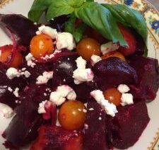 Beet salad with tomatoes and feta cheese.