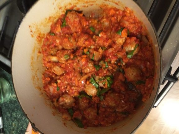 Gnocchi cooked in a rich tomato-based sauce with herbs.