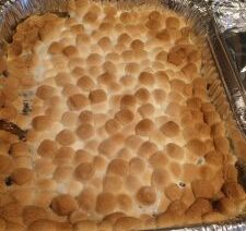 Toasted marshmallow dessert in foil tray.