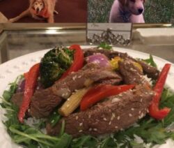 Stir-fry beef with vegetables and dogs.