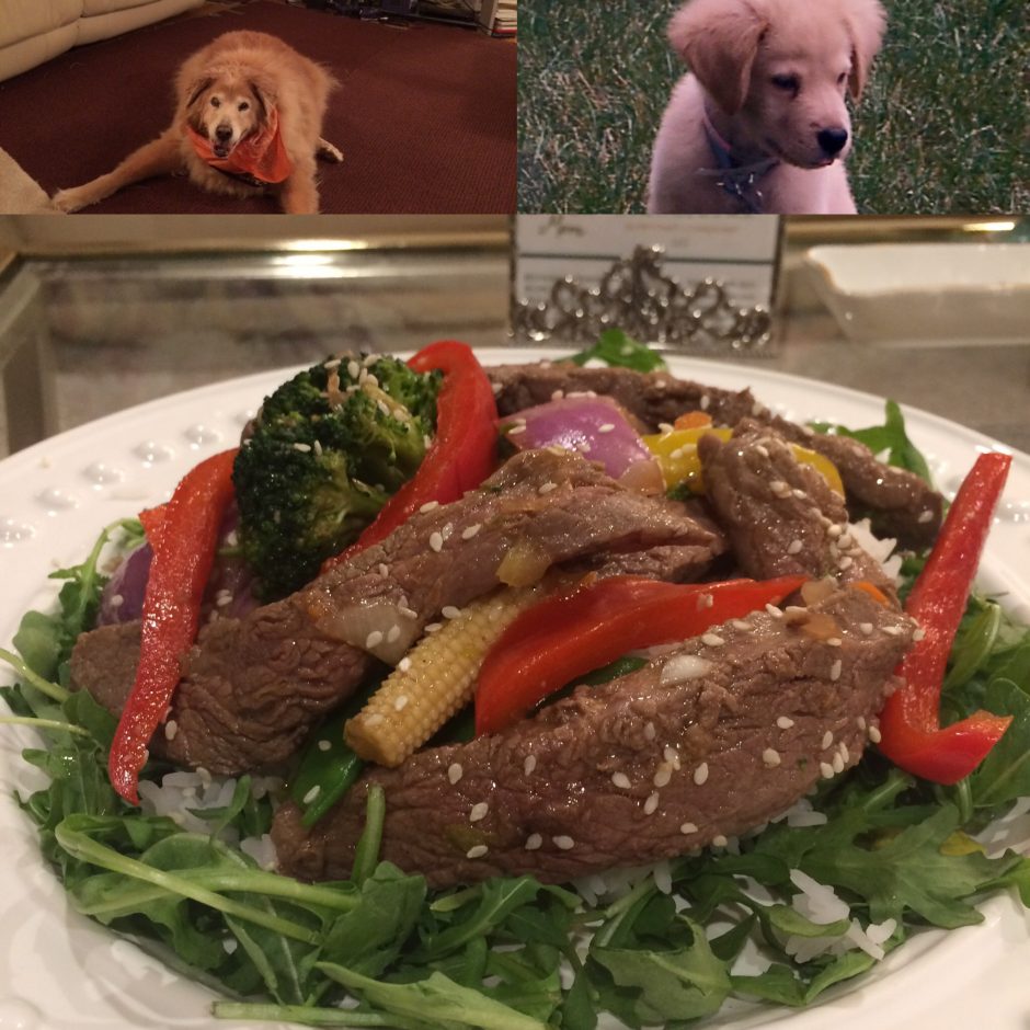 A colorful steak salad with fresh vegetables and greens.