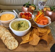 Snack platter with dips and vegetables.