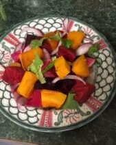 Colorful salad on decorative plate.