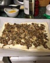 Mushroom tart preparation on kitchen counter.