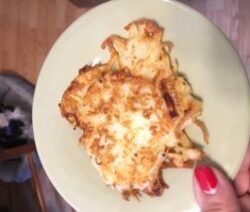 Potato latke on a green plate.
