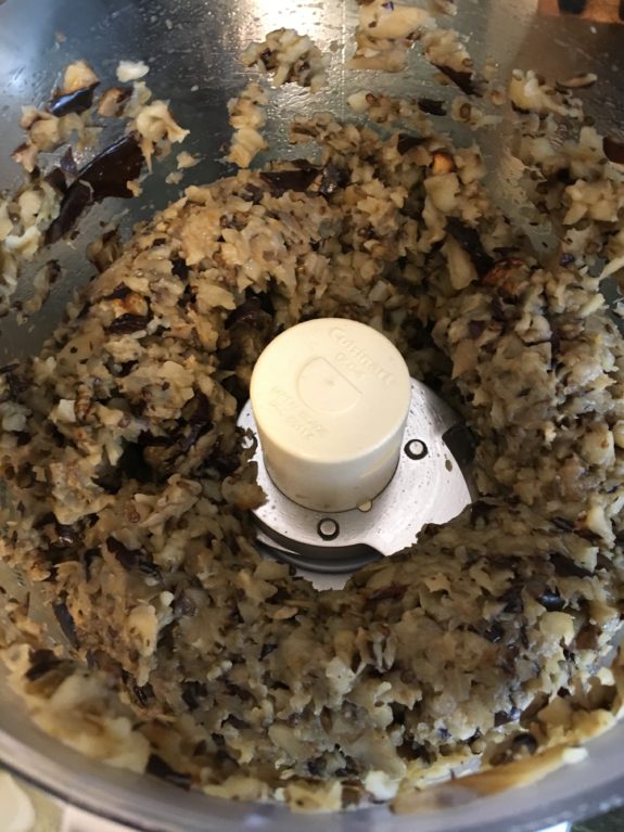 Blended mixture inside a food processor showing a creamy, chunky texture.