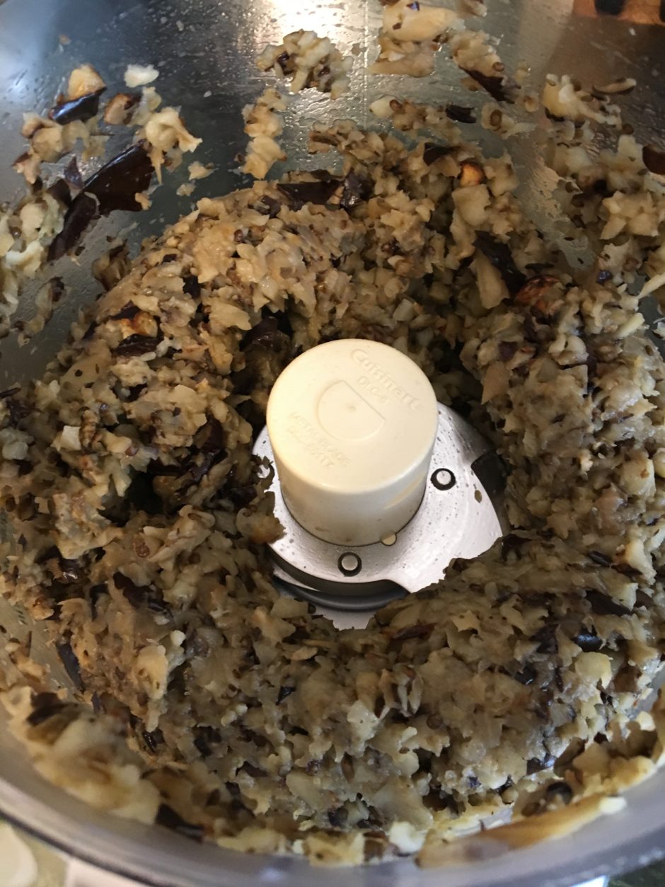 Blended mixture inside a food processor showing a creamy, chunky texture.