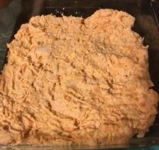 Baked dish with mashed orange ingredients.