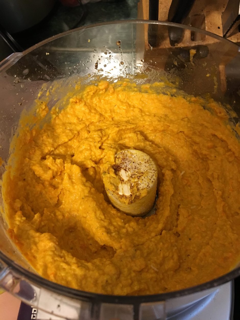 Close-up of creamy mashed sweet potatoes in a bowl.