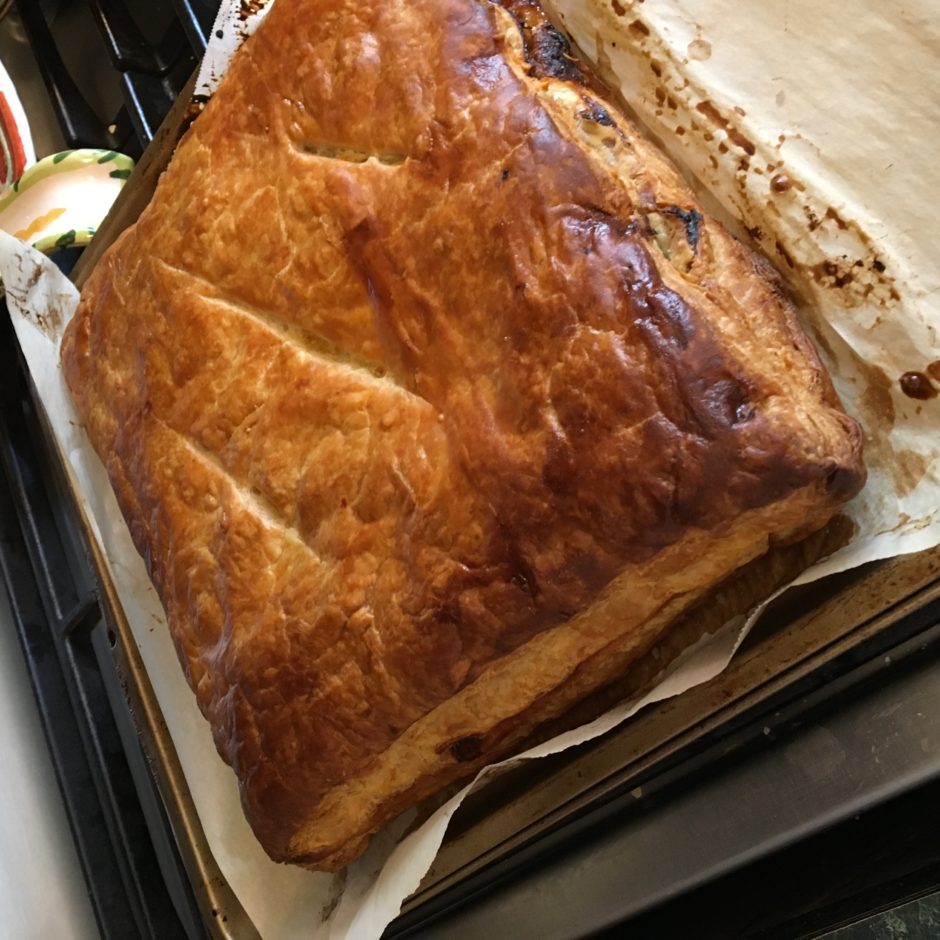 Golden-brown baked pastry on a tray.