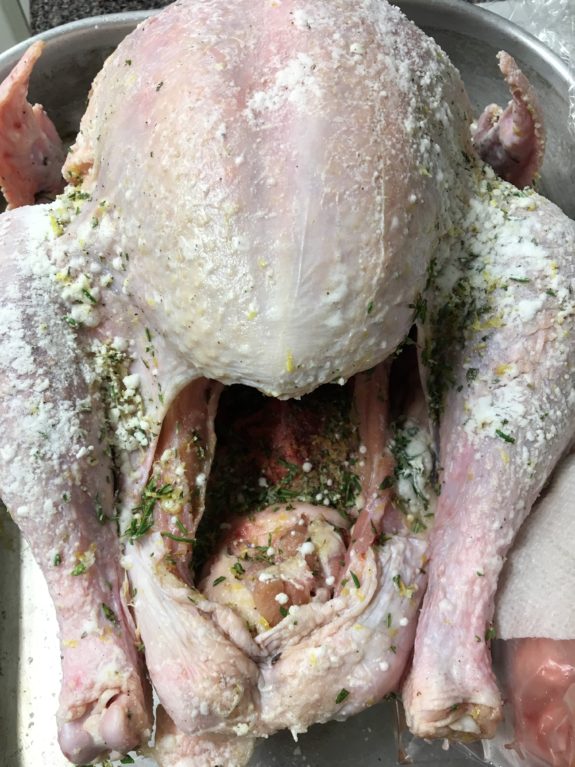 Close-up of a raw, unseasoned whole chicken.