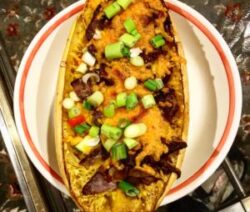 Stuffed squash with cheese and green onions.