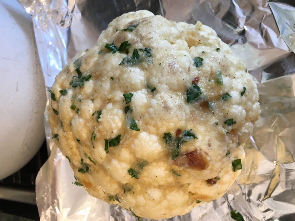 A round ball of seasoned dough with herbs and spices.