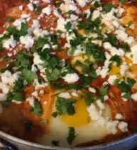 Shakshuka with herbs and feta cheese.