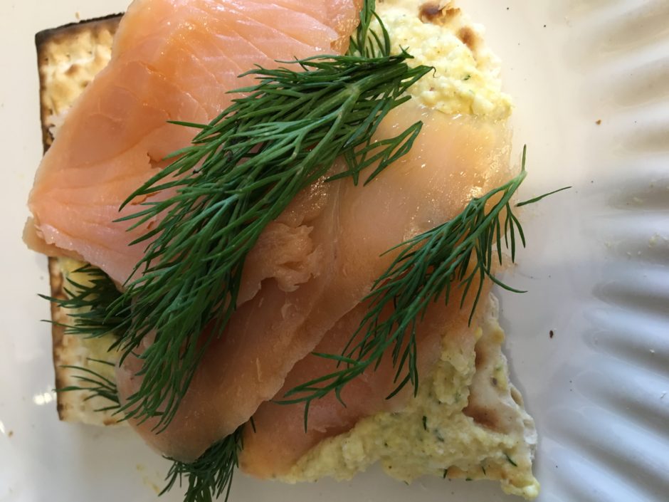 Smoked salmon with fresh dill on bread.