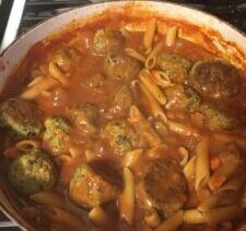 Pasta with meatballs in tomato sauce.