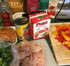 Ingredients for cooking: chicken, peppers, tomato products.